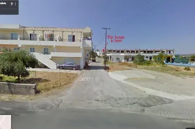 an empty road in front of a building at Gennadi Big House in Gennadi