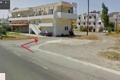 an image of a building with a red arrow on the street at Gennadi Big House in Gennadi