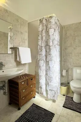 a bathroom with a toilet and a sink at Gennadi Big House in Gennadi