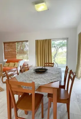a dining room with a table and chairs at Gennadi Big House in Gennadi