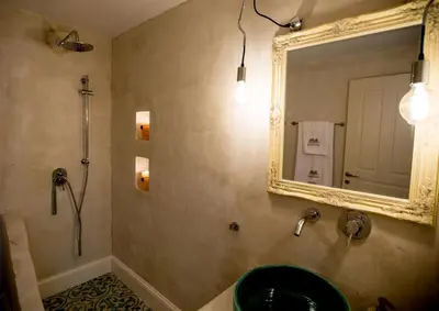 a bathroom with a sink and a mirror at Chic & Modern Apartments with swim access in Halki