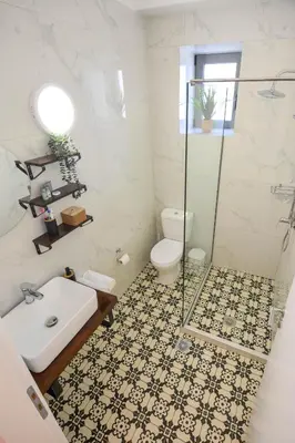 a bathroom with a sink and a toilet and a shower at Anassa Mountain House in Émbonas