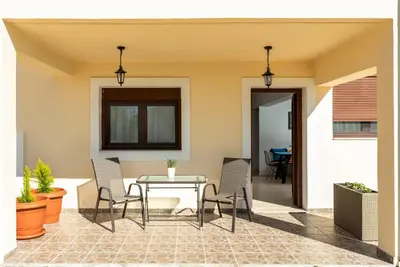 a patio with a table and chairs at Mayas House Greece Rhodes Kremasti in Kremasti