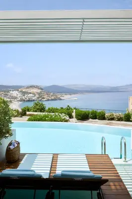 a swimming pool with a view of the ocean at Lindos Mare, Seaside Hotel in Líndos
