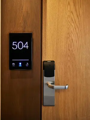a digital clock on a door with a speedometer at Mediterranean Hotel in Rhodes Town