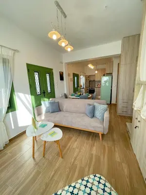 a living room with a couch and a table at Laurel LK Houses in Kritinia Rhodes in Kritinía