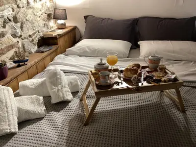 a living room with a coffee table with food on it at Casa Charma in Émbonas