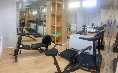 a gym with several exercise bikes in a room at A&B Ialysos villas and apartments in Ialyssos