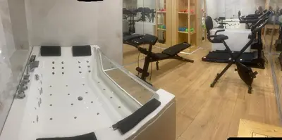 an indoor gym with a slide and exercise equipment at A&B Ialysos villas and apartments in Ialyssos