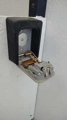 a lightswitch on a wall with a metal latch at MARY'S APARTMENT in Paradissi in Paradeísion
