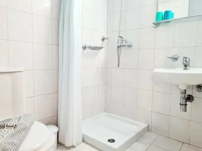 a bathroom with a toilet and a sink and a shower at G92 City Hotel in Rhodes Town