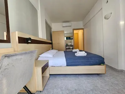 a bedroom with a bed and a desk at G92 City Hotel in Rhodes Town