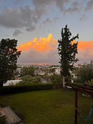 a view of a city from the backyard of a house at Garden House with sea view in Faliraki