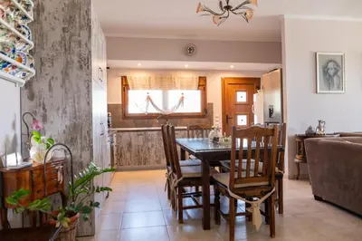 a kitchen and dining room with a table and chairs at Irini's house afandou in Afantou
