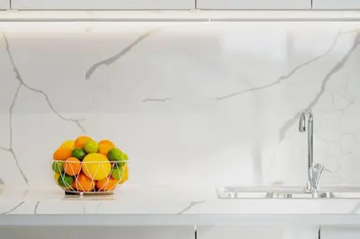 a bowl of fruit sitting on a counter next to a sink at Maison Du Jardin 2-Bedroom Apartment Private Outdoor Jacuzzi in Rhodes Town