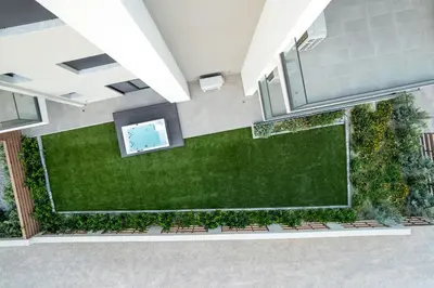 an overhead view of a large artificial lawn in a building at Maison Du Jardin 2-Bedroom Apartment Private Outdoor Jacuzzi in Rhodes Town