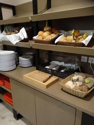 a kitchen with baskets of bread and other food at Hotel Africa in Rhodes Town