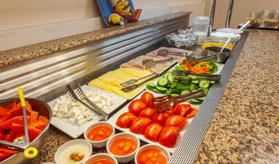 a buffet with different types of food on a counter at Hotel Africa in Rhodes Town