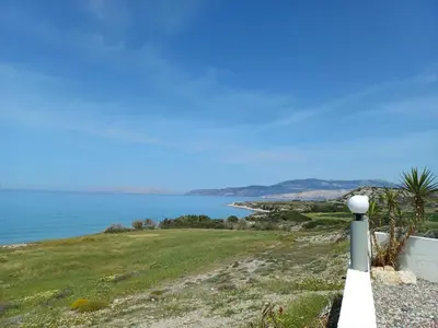 a white fence with a view of the ocean at Pearl Villas Apolakkia - Beach Front Villas with Private Pool in Apolakkiá