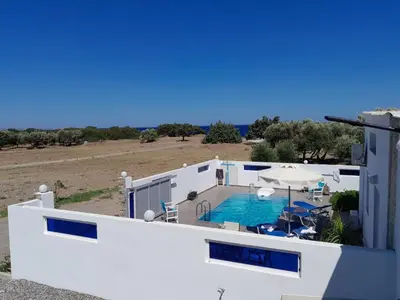 a view of a house with a swimming pool at Beach Pearl - Beach Front House with Private Pool in Gennadi