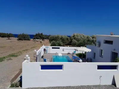 a view of a house and a swimming pool at Beach Pearl - Beach Front House with Private Pool in Gennadi
