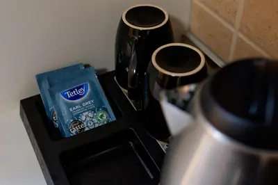a box of tea sitting on top of a stove at Rhodes Island Elli Beach Apartments in Rhodes Town