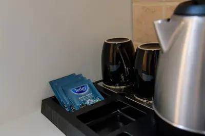 a counter top with a coffee pot and a box on it at Rhodes Island Elli Beach Apartments in Rhodes Town