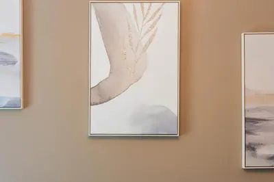a picture hanging on a wall next to three paintings at Rhodes Island Elli Beach Apartments in Rhodes Town