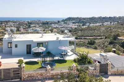 a villa with a view of a house at Sebastian Villas in Afantou