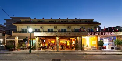 a building with a hotel on the side of a street at Alea Hotel Apartments in Ialyssos