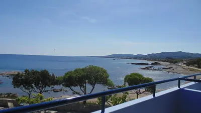 a view of the ocean from a balcony at Paraktio Beach Apartments in Kiotari