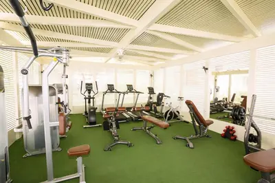 a gym with several treadmills and exercise bikes at Lydia Maris Resort & Spa in Kolimbia