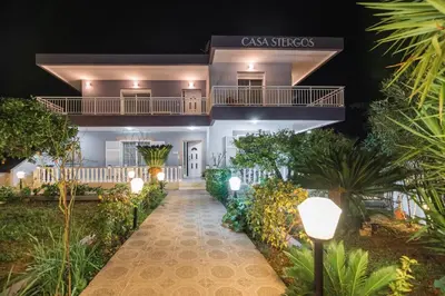 a view of the front of a building with lights at Casa Stergos 2apts in Archangelos
