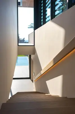 a staircase leading up to a house with a view of the ocean at Villa Casa Palmera in Ixia