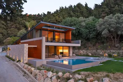a house with a pool in front of it at Villa Casa Palmera in Ixia