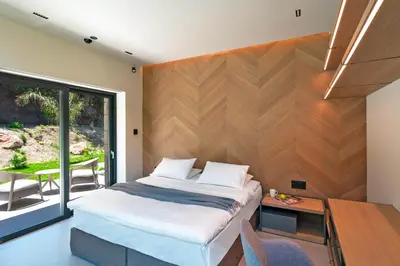 a bedroom with a bed and a desk and a table at Villa Casa Palmera in Ixia