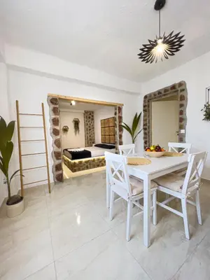 a dining room with a table and chairs and a bed at LA Casa Di Lusso N3 - Adults Only in Kolimbia