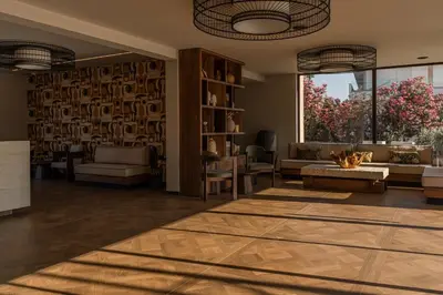 a living room with a couch and a table at Eleonas Boutique Hotel & Spa - Adults Only in Ialyssos