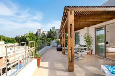 a balcony with a view of the city at The 12th City Hotel in Rhodes Town
