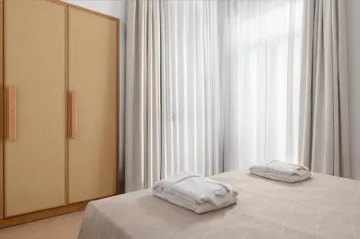two towels on a bed in a bedroom at The 12th City Hotel in Rhodes Town