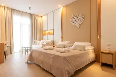 a bedroom with a large bed in a room at The 12th City Hotel in Rhodes Town