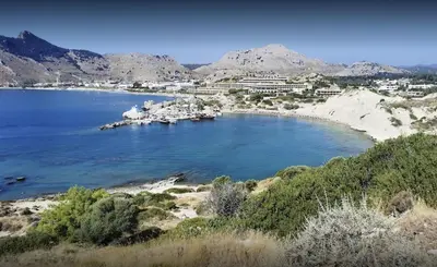 a large body of water with a town in the background at Renthub Villas at Kolympia in Kolimbia