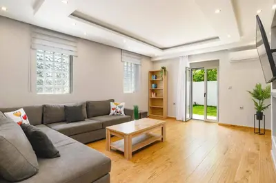 a living room with a couch and a coffee table at Villa Costa by Villa Plus in Ialyssos
