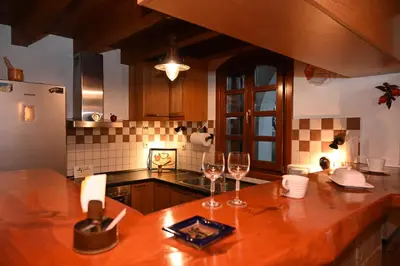 a kitchen with two wine glasses on a counter at VILLA VICTORIA OLD TOWN in Rhodes Town