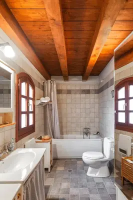 a bathroom with a tub and a toilet and a sink at VILLA VICTORIA OLD TOWN in Rhodes Town