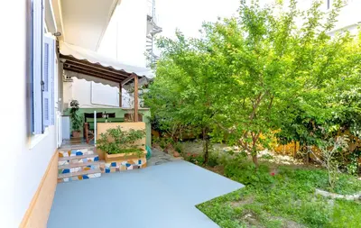 a view of a garden from the outside of a house at Eddy's Apartment in Rhodes Town