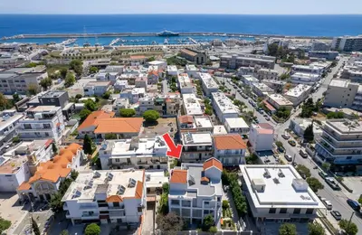 an aerial view of a city with houses and the ocean at Eddy's Apartment in Rhodes Town