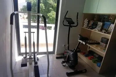 a room with two exercise bikes in front of a window at Piazza Masari in Haraki
