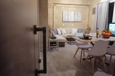 a living room with a couch and a table at Piazza Masari in Haraki