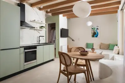 a kitchen and dining room with a table and chairs at Rhodes Island View in Ixia